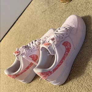 Nike Women's Light Pink Sneakers with Red Accents